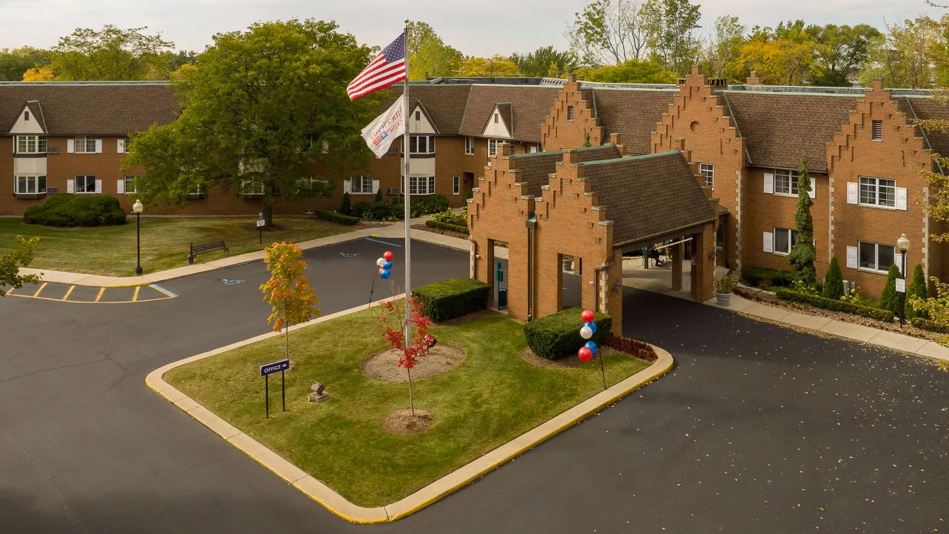 Large exterior shot of American House East I, a retirement community in Roseville, Michigan
